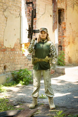 Portrait of a Ukrainian woman shooting from a machine gun