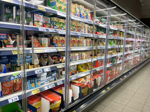 Berlin / GERMANY - June 25, 2022. Refrigerated shelves in a store. Shelves with products.