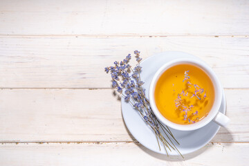 Organic lavender tea cup. Hot floral herbal tea with fresh lavender flowers, in white ceramic cup...