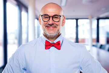 Confident businessman standing at the boardroom