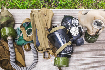 Used gas masks are being prepared for disposal. Military versions of old gas masks