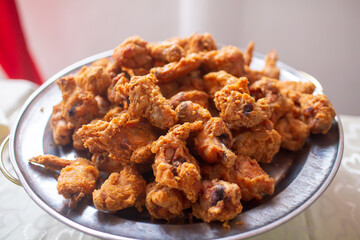 A plate full of home made fried chicken ready to be eaten