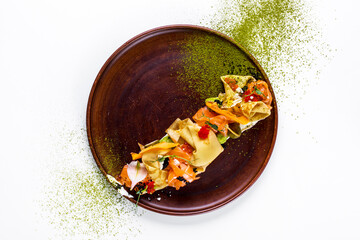 Pancakes with salmon, tobiko caviar, salmon caviar, sprouts of green peas, sphrom