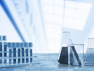Science glass flask with extraction glassware set with blue chemical molecular structure in...