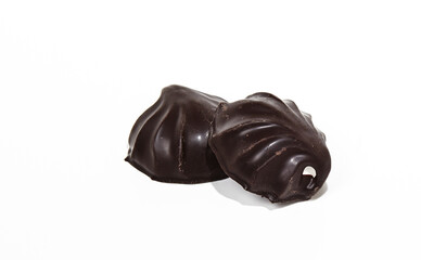 Chocolate covered marshmallows isolated on white background. Yummy mini dessert, closeup