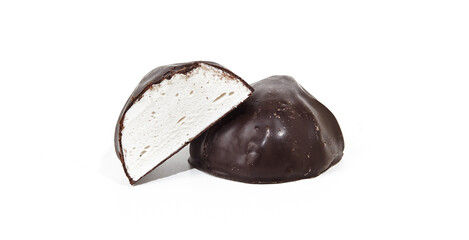 Close-up shot of whole marshmallows and one half covered with chocolate isolated on white background. Yummy mini dessert, closeup