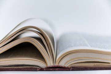 Large open book. Encyclopedia in red hardcover. Close-up. Selective Focus.