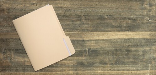 Paper file with documents on wooden table, top view. Space for text