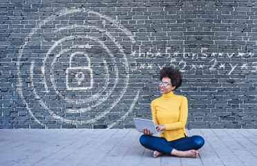 Young woman using laptop with secure internet connection