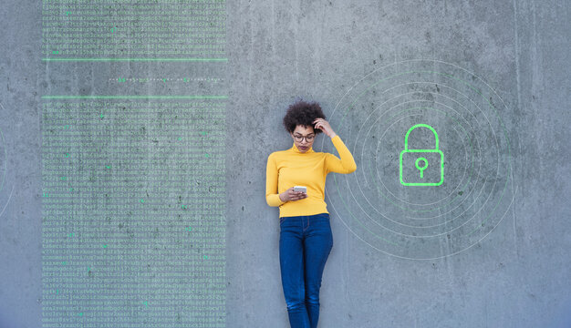 Confused Woman Looking At Smartphone With Data Lock Painted On Wall