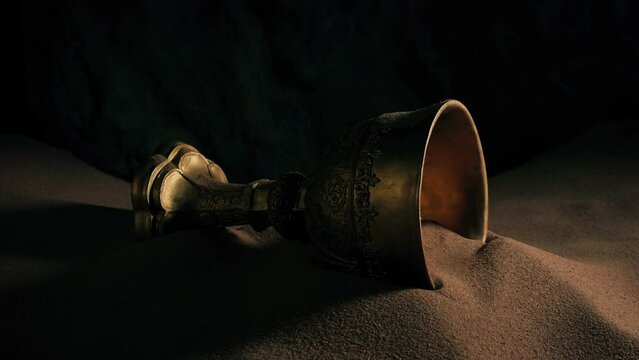 Man Picks Up Golden Chalice In Cave