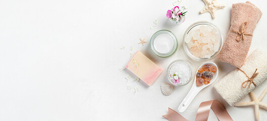 Cosmetic spa body care kit on a white background with space to copy. View from above. Spa salon.