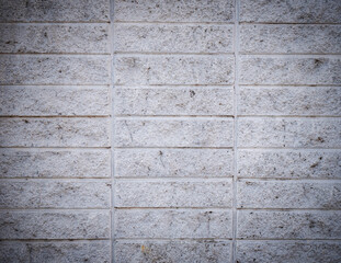 Rough faux stone wall paneling as a background wall decoration. Close-up photo of the wall texture of a modern house