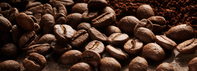 Roasted coffee beans different sort ground and whole close up background