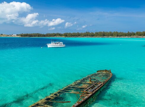 The wreck of the Sea Fern deliberately sunk in 1930 as a breakwater for a deep sea diving expedition, Castle Harbour, Bermuda, Atlantic