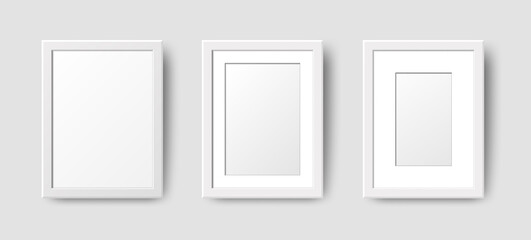 Realistic Rectangle Empty Wall Photo Frames set. Vector vertical white picture frame mockup template with shadow on gray background. Mockup for poster, banner, photo gallery, painting, presentation