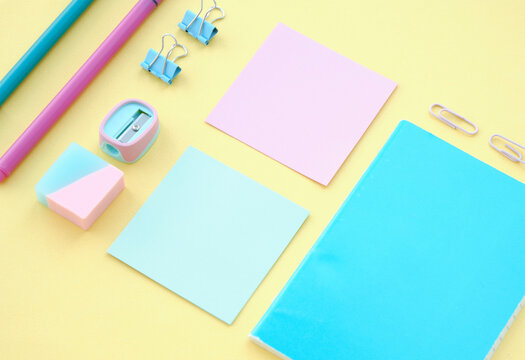 School stationery on yellow background, flat lay with space for text. Back to school