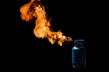 The explosion of household gas cylinders isolated on black background.