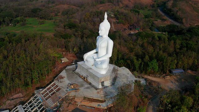 Wat Phrathat Pu Jae buddha and Huai Mae Toek lake in Phrae province, Thailand