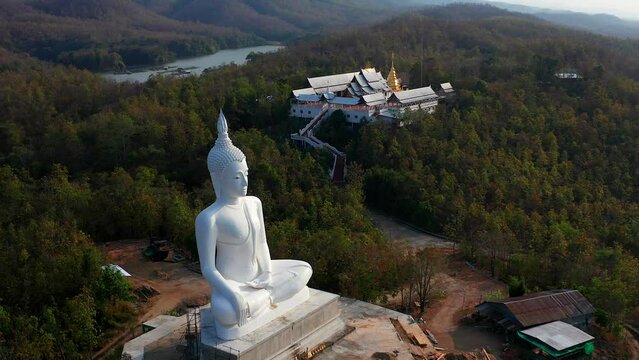 Wat Phrathat Pu Jae buddha and Huai Mae Toek lake in Phrae province, Thailand