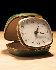 old green clock with cracked texture