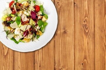 Fresh spring vegetable salad with tomatoes and peppers in the bowl.