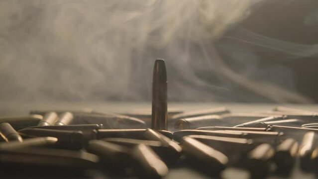 Smoke. The bullets are on the table.