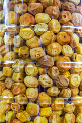 Close-up of a bottle of traditional Chinese pickled lemons