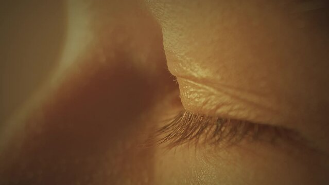 Young girl eye closeup loop. Blinking. Profile. Slow motion. Macro. 