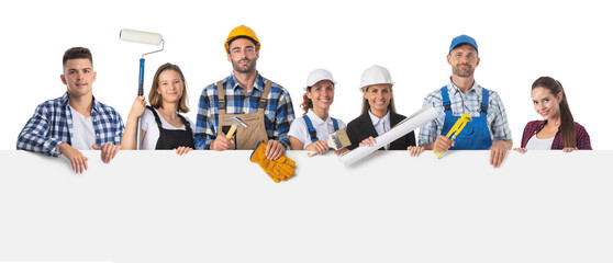 Construction workers holding blank billboard