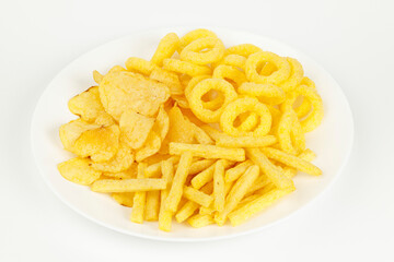A plate of spicy beer snacks, French fries, rings and chips.