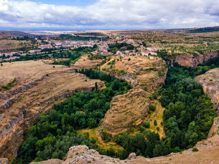 Vegetation at the foot of the hills that house the medieval village of Sepulveda in Spain.