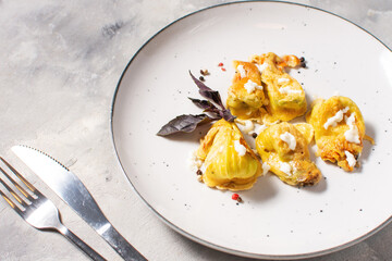 Fried zucchini flowers stuffed with cream cheese, ricotta, tasty Italian dish