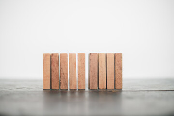 Wooden blocks and domino effect risk management concept business success, problem solving, strategy...