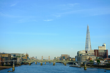 London, UK - 14 May 2022. City skyline and river Thames viewed from Blackfriars Station. An afternoon shot with clear blue sky.
