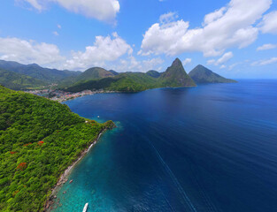 Naklejka na ściany i meble A panorama view towards Soufriere Bay, St Lucia with the Pitons in the distance.