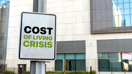Obraz premium Cost of Living Crisis on sign in a downtown city setting 