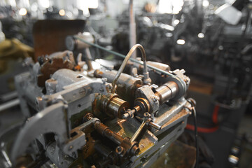 Close-up of hobbing machine for cutting sprockets and other small details, focus on drill tool