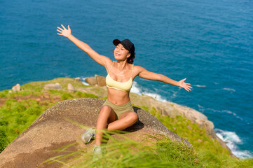 Beautiful asian woman in sportswear trekking on mountain trail, Travel and ecotourism concept.
