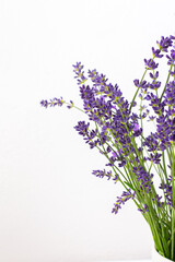 Beautiful summer lavender flowers in a vase close up, part of a home interior