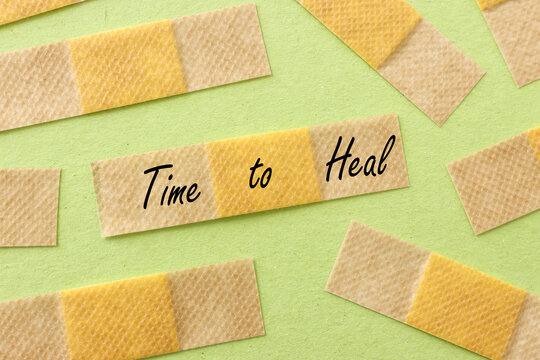 Adhesive bandage plasters and the text time to heal