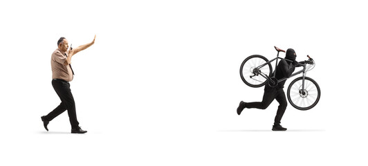 Security officer chasing a thief running and stealing a bicycle