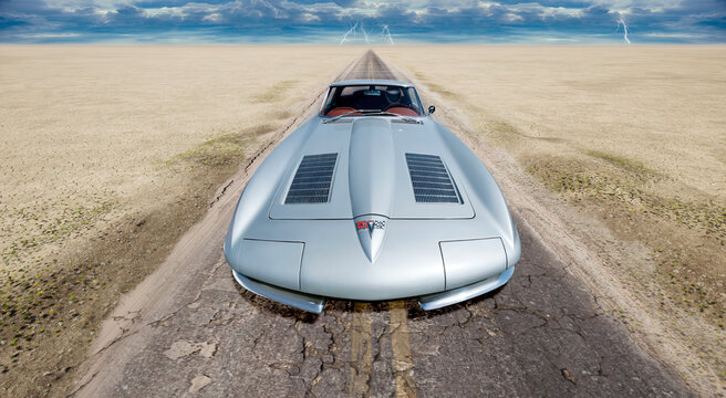 Old Corvette 1963 sports car in a desert road, wide angle front view.