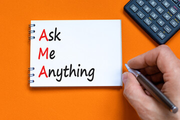 AMA ask me anything symbol. Concept words AMA ask me anything on white note on a beautiful orange...