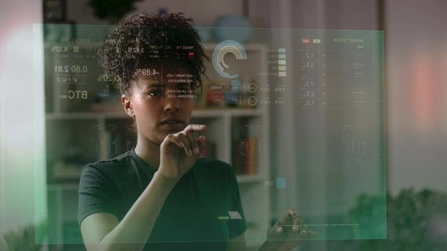 Young African American Woman Using Futuristic Augmented Reality Software Interface for Managing Business and Marketing Projects. Virtual Reality VFX Animation with Financial Data and Charts. 