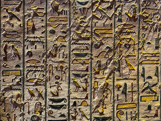 A small stone with hand carved Ancient Egyptian hieroglyphics. This stone is part of a Museum...