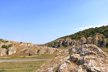 Fototapeta na wymiar mountain landscape with some of the oldest limestone rock formations in Europe, in Dobrogea Gorges (Cheile Dobrogei), Romania