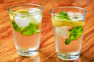Summer drink with lemon, mint and ice