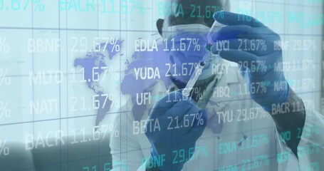 Animation of stock market over african american doctor wearing face mask holding syringe and vaccine - Powered by Adobe