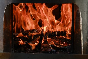 Fire flames from a wood stove fire isolated on a black background